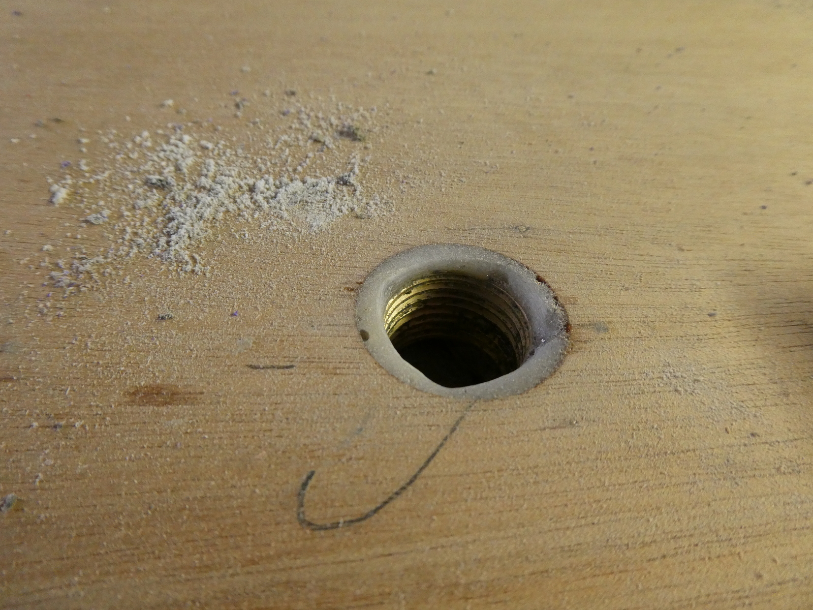 Water tank fill hole, just before I jam it full of plumbers putty from below