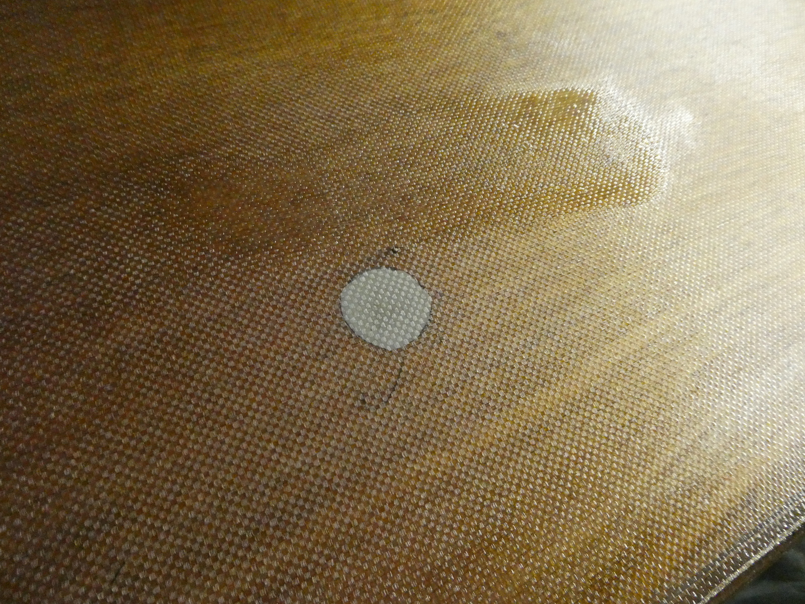 Here ou can see the water tank fill hole being protected by plumbers putty while the epoxy sets